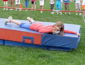 A J.A. Laird Track and Field Day participant waves to the camera.