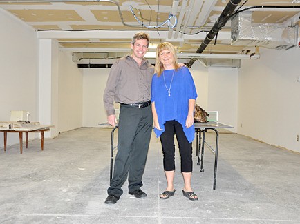 Dr. Francois Louw and Colleen Wagner stand in what will become a studio for dance and much more over the coming months.
