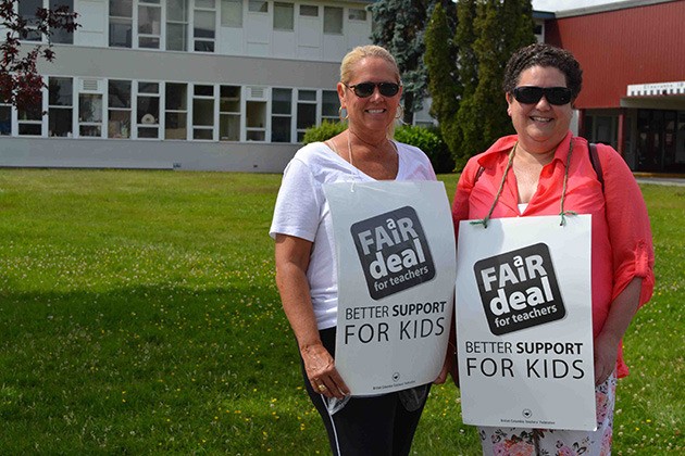 Walking the picket line on Wednesday are teachers Margaret Carmichael and Gayle Abbott-Mackie.