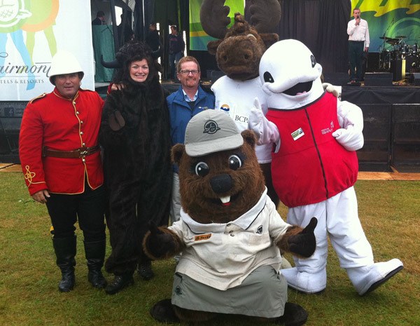 Environment Minister Terry Lake meets with mascots in Stanley Park Sunday to mark the 100th anniversary of B.C. parks. Such items no longer take precedence on the B.C. government website.