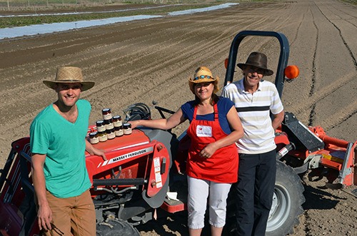 (l-r) Tanner Saunders with his parents Faith and Gordon are the brains and brawn behind Saunders Family Farm in Windermere