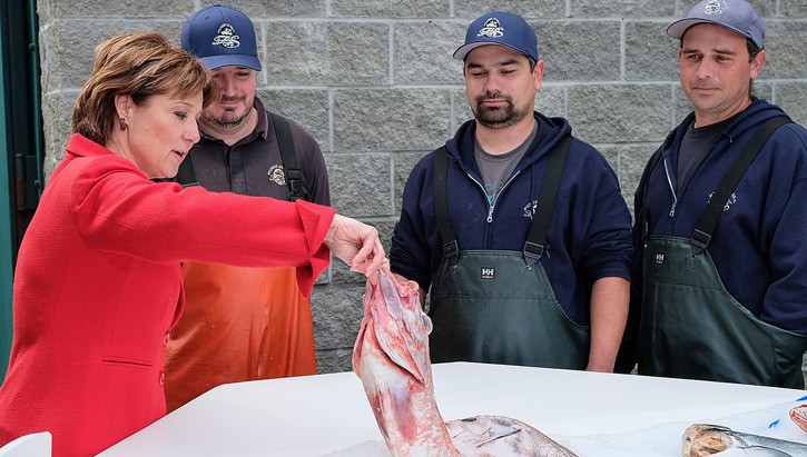 Premier Christy Clark promotes the benefits of the Trans-Pacific Partnership at a Victoria seafood shop Wednesday.