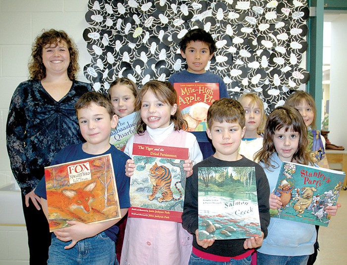 2007: Eileen Madson Primary Students celebrate the win of $250 in books for the school library via a literacy week competition.