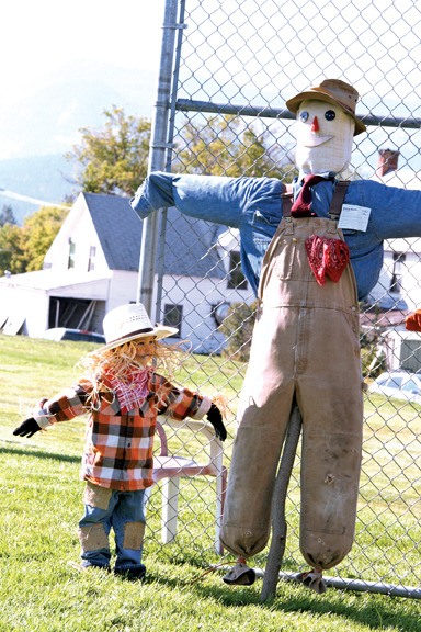 A scarecrow in training takes some tips from one of the pros at the Windermere Fall Fair and Scarecrow Festival Saturday