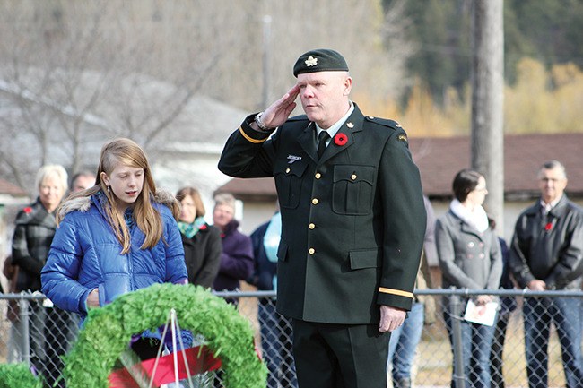 Cadet Instructor Cadre and Canal Flats resident John Restemeyer salutes the cenotaph after laying a wreath with his daughter Heidi Restemeyer