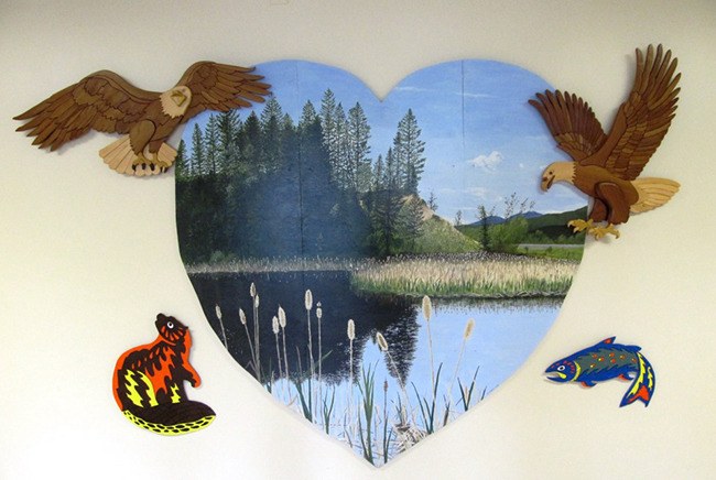 The new mural at Edgewater Elementary School by artist Susan Fahrni was created as a compliment to the two eagles carvings by Dave Sawchuk that already adorned the school's walls.