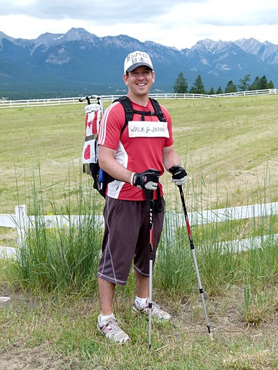 Steve Johnson takes a break just off of Westside Road during his trek for Japan relief.