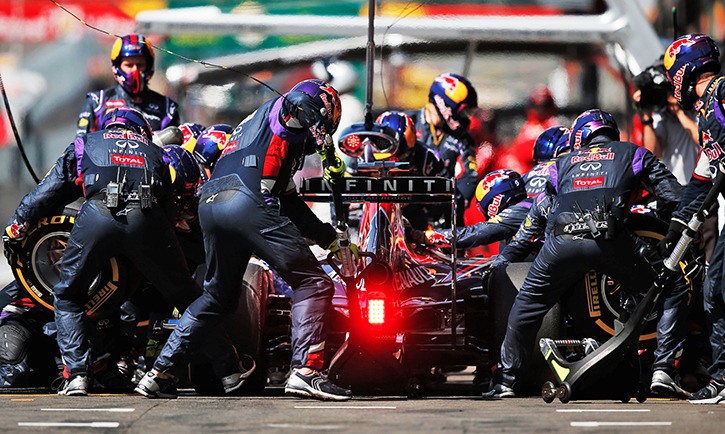The Infiniti-Red Bull pit crew readies a race car to return to action during the 2014 F1 Belgian Grand Prix.