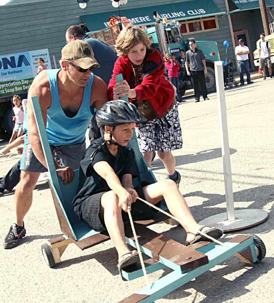 The Simpsons soap box derby team round the bend and head for the finish line during a soap box derby at this year's Valley Appreciation Day. Team Simpsons was able to win the day