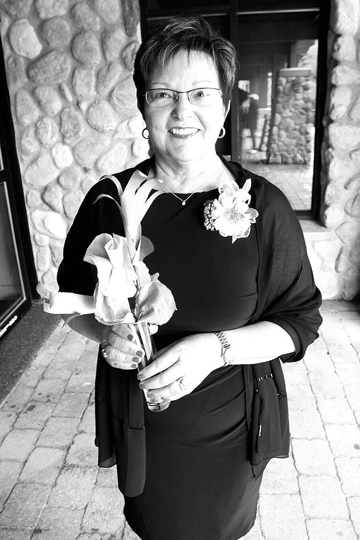 2010 — Bendina Miller holds some of the centrepiece flowers made by EMP Grade 3 students to celebrate her retirement from the school district.