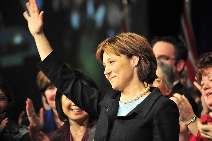 Christy Clark is surrounded by B.C. Liberal MLAs on stage at the Vancouver convention centre Saturday.