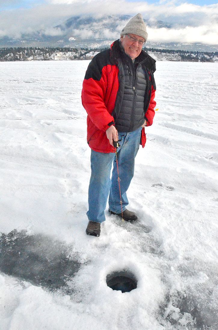 Bryan Gerrie jigs his rod trying to catch the biggest fish during the Kinsmen Club’s annual fishing derby on Lake Windermere on Saturday
