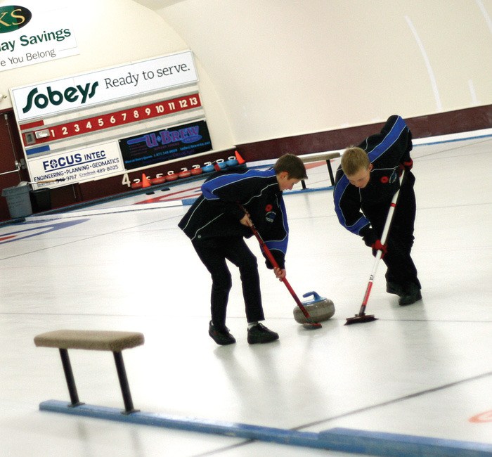 Members of Invermere's juvenile men's team brush up on their skills during a friendly match in November.