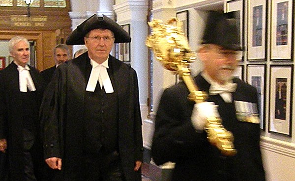 The Sergeant-at-Arms leads speaker Bill Barisoff into the chamber Monday