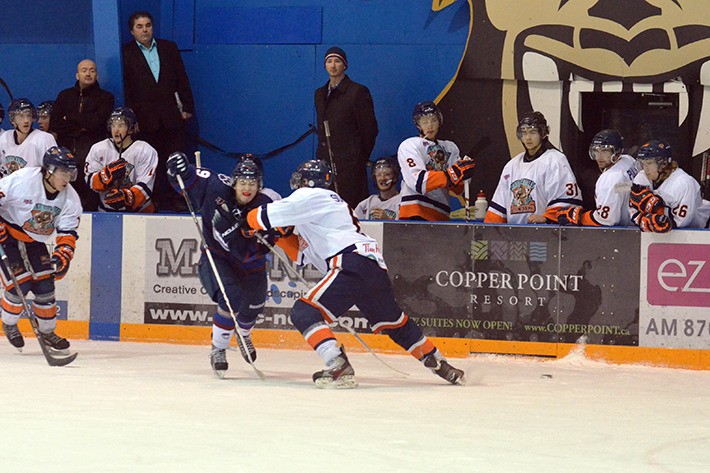 Defenseman Zach Schlitt blocks a Creston Valley forward from collecting the puck during Friday night's action at the Eddie Mountain Memorial Arena. It was a rough start to the weekend for the Rockies