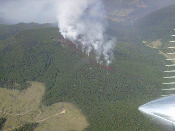 The red circle surrounding the fire is retardant dropper by air tankers to help prevent any further spread of the fire.