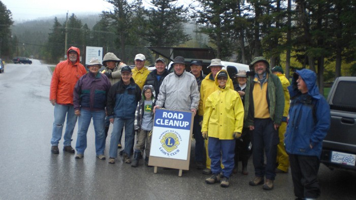 Braving the Elements: Fairmont Hot Springs Lions and other community members pose for a photo before setting out in the pouring rain to begin their twice-yearly community clean-up.