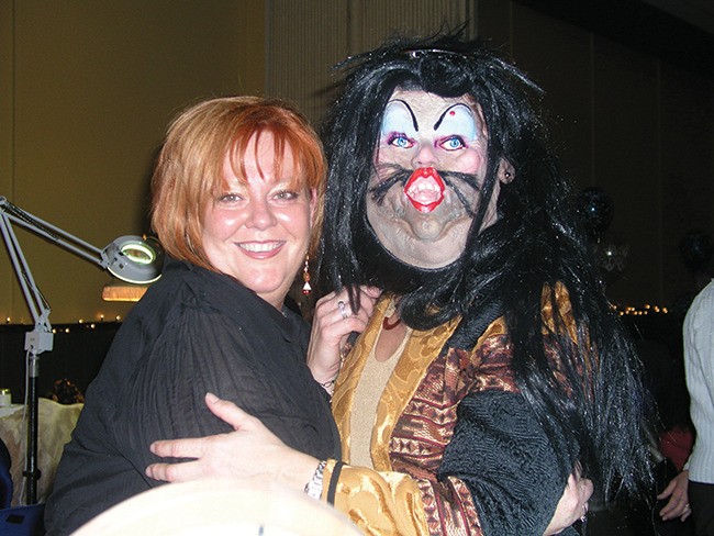 November 2003 — Glitz and glamour was all the rage at the Invermere Community Hall on November 8th during the community fashion show. Sandra Beingessner (left) appears as a Beauty