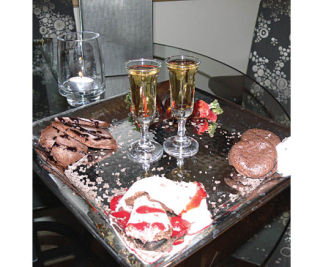 Food and beverage manager Aaron Sarson (above) presents CasaVino's chocolate tray on January 21. The tray (right) contained