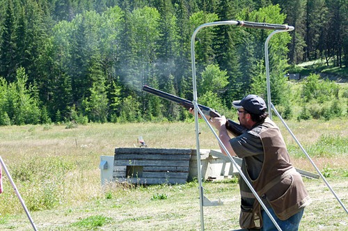 A sharp-shooter fires at a clay target.