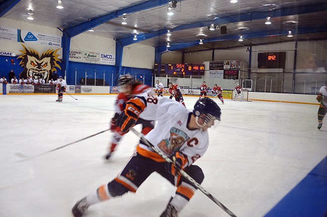 Columbia Valley Rockies captain Adam Pulliam dekes out a Sicamous Eagles forward with a crafty pivot during last Friday's game. The Rockies beat the Eagles by a score of 3 – 1.