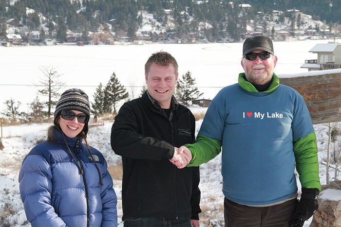 Lake Windermere Ambassadors program co-ordinator Kirsten Harma and District of Invermere mayor Gerry Taft congratulate 'Catch the Freeze' contest winner Don Steedman on Thursday (December 13).