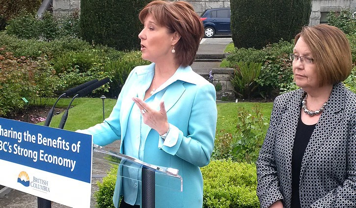Premier Christy Clark and Jobs Minister Shirley Bond announce two-stage boost to minimum wage at the B.C. legislature Wednesday.