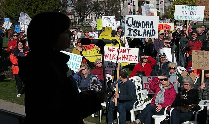 Islands Trust chair Sheila Malcolmson speaks to rally against ferry route cuts at the B.C. legislature Tuesday.