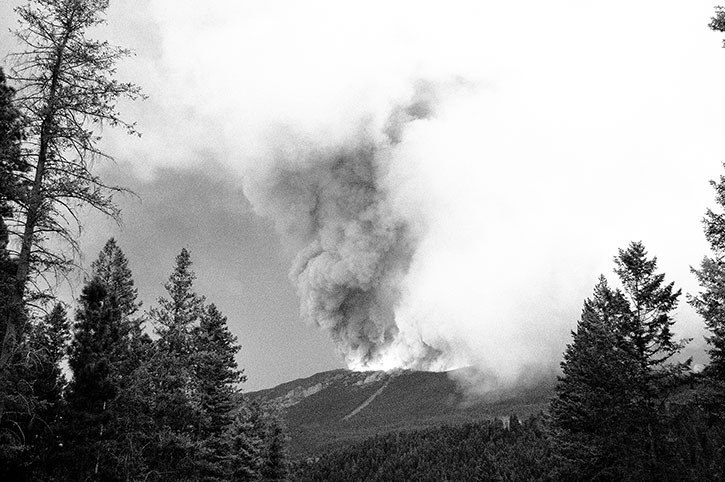 The White Tail Brook crackles with visible flames and sends up smoke.