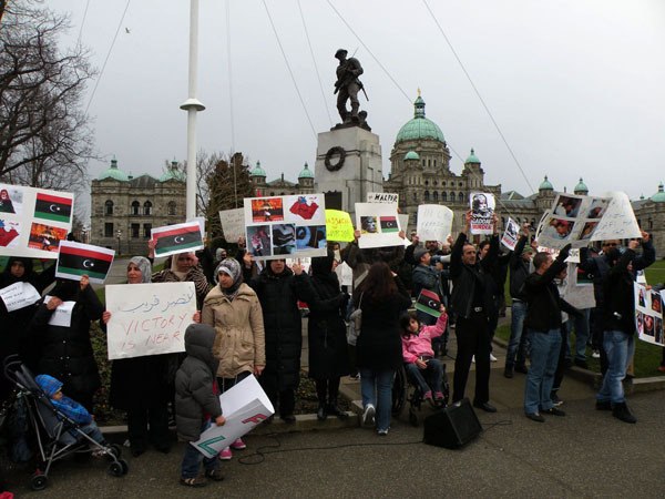 Protesters call for the downfall of Libyan dictator Moammar Gadhafi Tuesday at the B.C. legislature. Protests were staged around the world as Gadhafi lashed out against a popular uprising from the Libyan people.