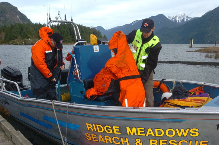 Search and Rescue members prepare to head out on Pitt Lake to look for missing boaters.