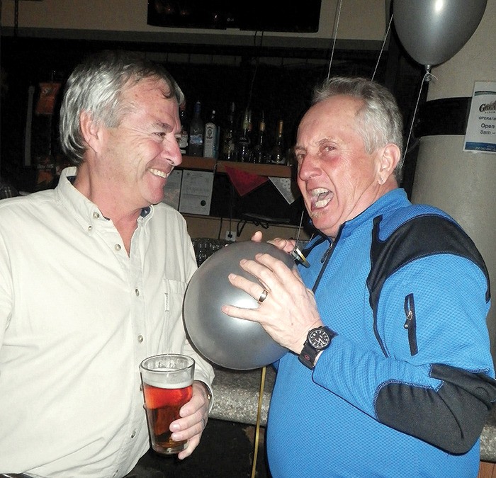 George St. Amour (left) and Marcel Labrie catch up at the T-Bar over beer and helium during Panorama's Staff Alumni Reunion event held on March 9 and 10 as part of  the ski resort's 50th anniversary.
