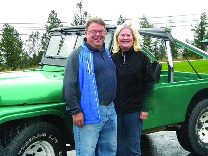 Tony and Merle Giasson stand next to their new-to-them 1970 Jeep that Tony won in this year's Columbia Valley Rockies annual Classic Car Raffle.