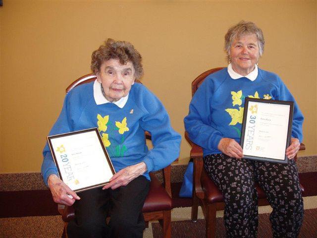 Kay Maras representing 25 years of service along with Maria Kloos representing 30 years get awards marking their outstanding contributions to the Columbia Valley Unit of the Canadian Cancer Society.