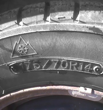 The North American symbol for a winter tire is a mountain with snowflake. All-season tires with 'M+S' for 'mud and snow' are also acceptable for restricted roads in B.C.