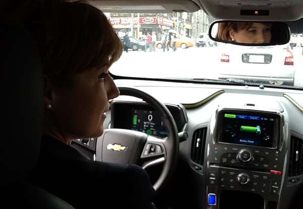 Premier Christy Clark takes a Chevy Volt electric car for a spin in downtown Toronto last week.