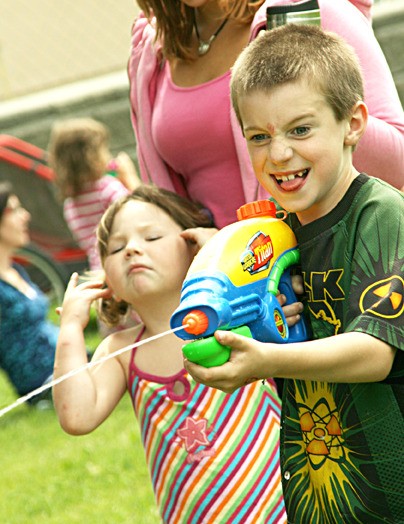 An Edgewater Elementary student takes full advantage of the toys available during Edgewater Elementary's Fun Day.