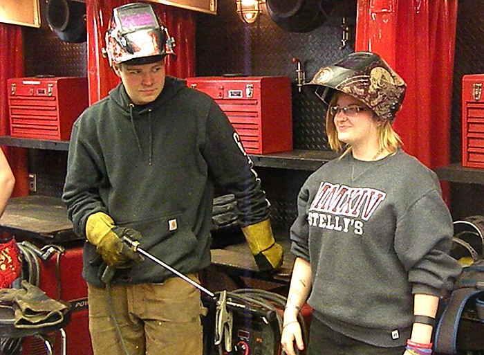 Welding students from Vancouver Island University: funding is being doubled for programs that start trades training in high school.