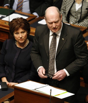 Premier Christy Clark listens as Finance Minister Mike de Jong presents the 2014-15 budget in the B.C. legislature Tuesday.