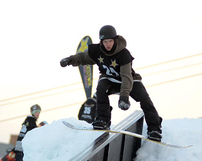 A boarder shows off his balance during Panoramas Rail Jam taking place during the Mountain Stampede on Saturday