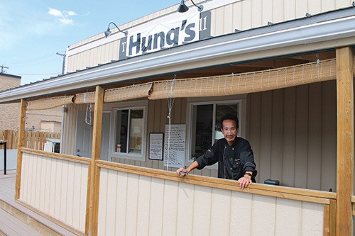 Hung Khuu poses in front of his new enterprise