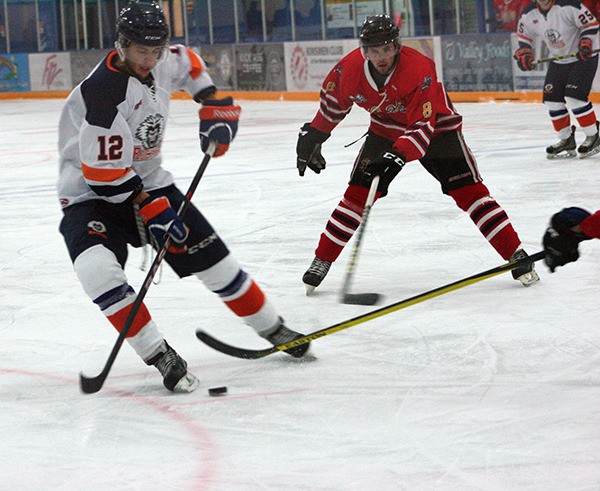Columbia Valley Rockies player Damon Raven faces off against a Golden Rockets player at the Eddie Mountain Memorial Arena in Invermere on September 3rd in one of the Rockies’ pre-season exhibition games.