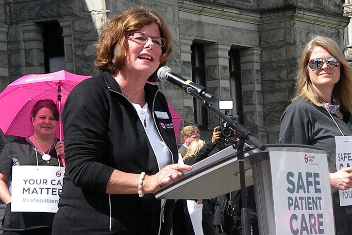 B.C. Nurses' Union president Gayle Duteil speaks to rally at B.C. legislature Thursday. Their contract expired more than a year ago.