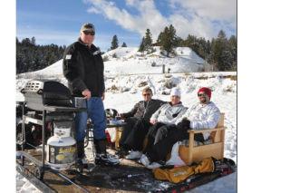 A group of hard-working golfers take a break at the annual Snow Golf event held on Lake Windermere.  Darryl Crane/echo photo