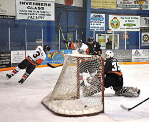 The Columbia Valley Rockies hit the highs and lows of the hockey season in a two game span. Pictured far left is the joy of victory as the Rockies beat up on the Kimberley Dynamiters. Directly left is the agony of defeat as the team was pounded by the Golden Rockets. Darryl Crane/ echo photo