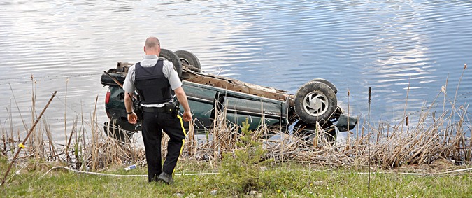 The flipped car that fell into Paddy Ryan Lake.