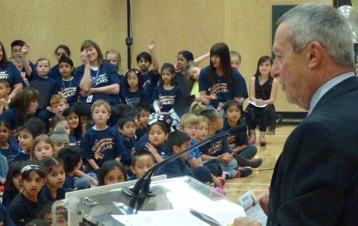 Education Minister Peter Fassbender addresses students at the official opening of Goldstone Park Elementary