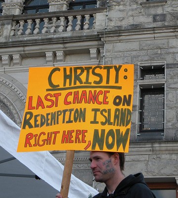 A striking teacher joins a rally at the B.C. legislature during the lengthy dispute that disrupted graduation in 2013 and closed schools in the fall of 2014.