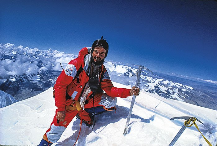 Wilmer resident Pat Morrow is all grins on the summit of Everest in 1982 during the first Canadian expedition to the world's highest mountain. Mr. Morrow and co-author Sharon Wood (who was part of a 1986 Everest expedition) have released a new e-book about their experiences on the mountain — 'Everest: High Expectations'.