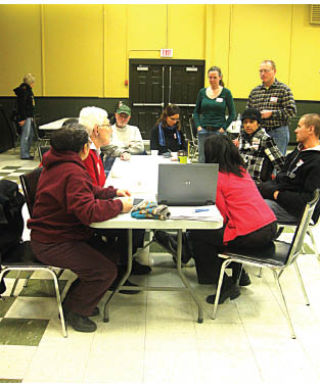 Invermere residents attending the afternoon session are given an overview of the morning presentation before moving on at the Lake Windermere Memorial Community Hall. Madison Samuel-Barclay/Echo Photo